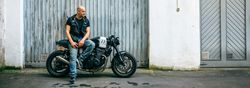 Biker posing with a motorcycle