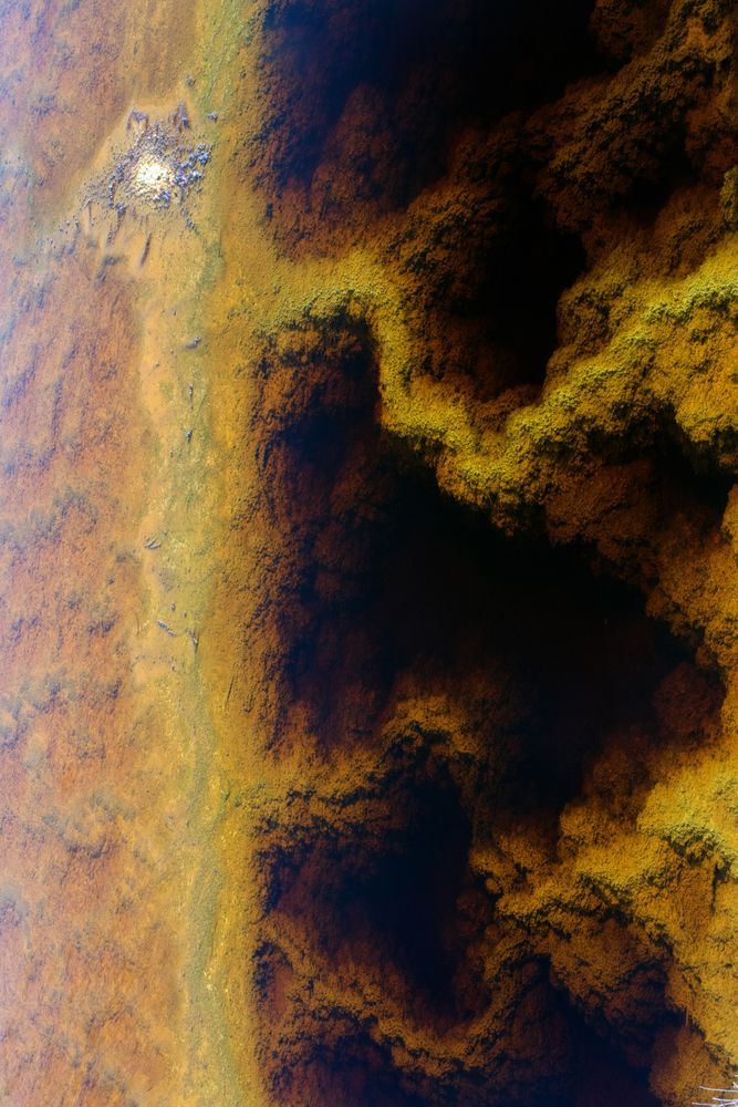 Multicolored mineral stratum on river