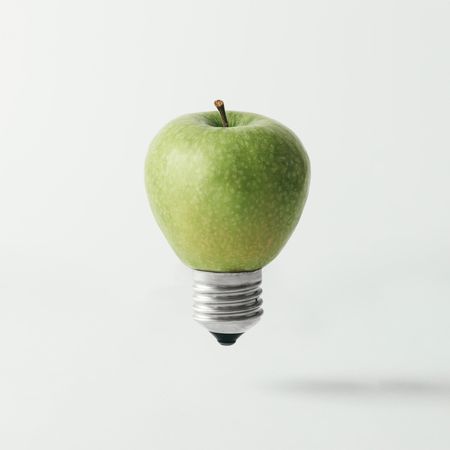 Apple lightbulb on light background