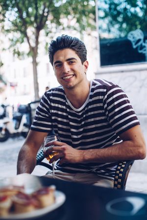 Portrait of casual young man in a terrace