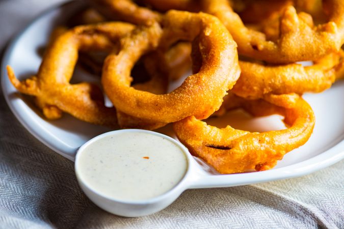 Plate of onion rings with dip