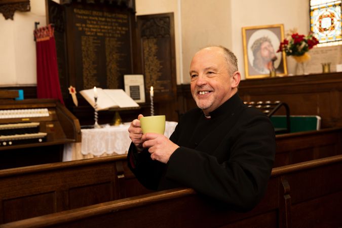 Vicar with tea