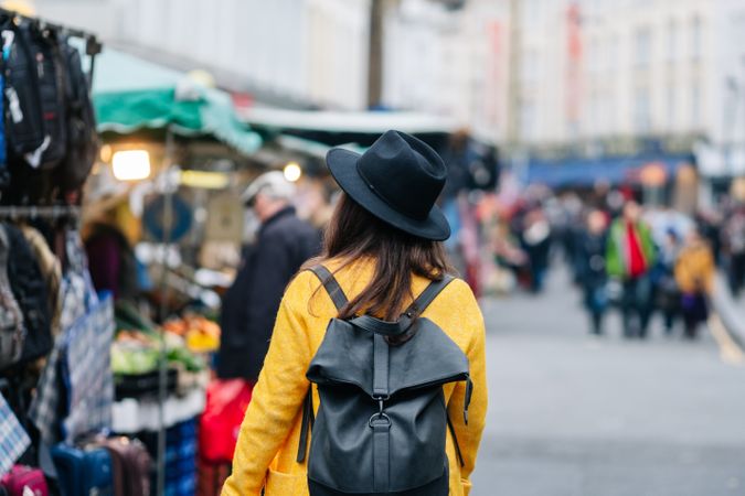 Unrecognizable tourist walking on street during festival