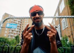 London, England, United Kingdom - August 27, 2022: Portrait of smiling man at Notting Hill Carnival