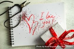 Valentine Day holiday concept with "I love you" written on paper with present 4BaamP