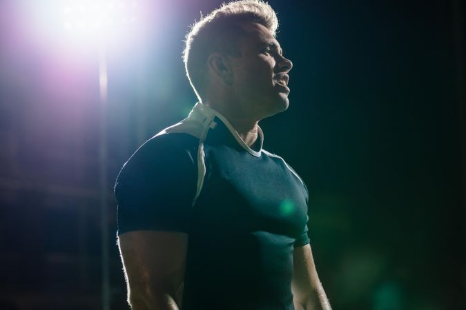 Rugby player on field under lights