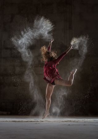 Young woman between fog in darkness