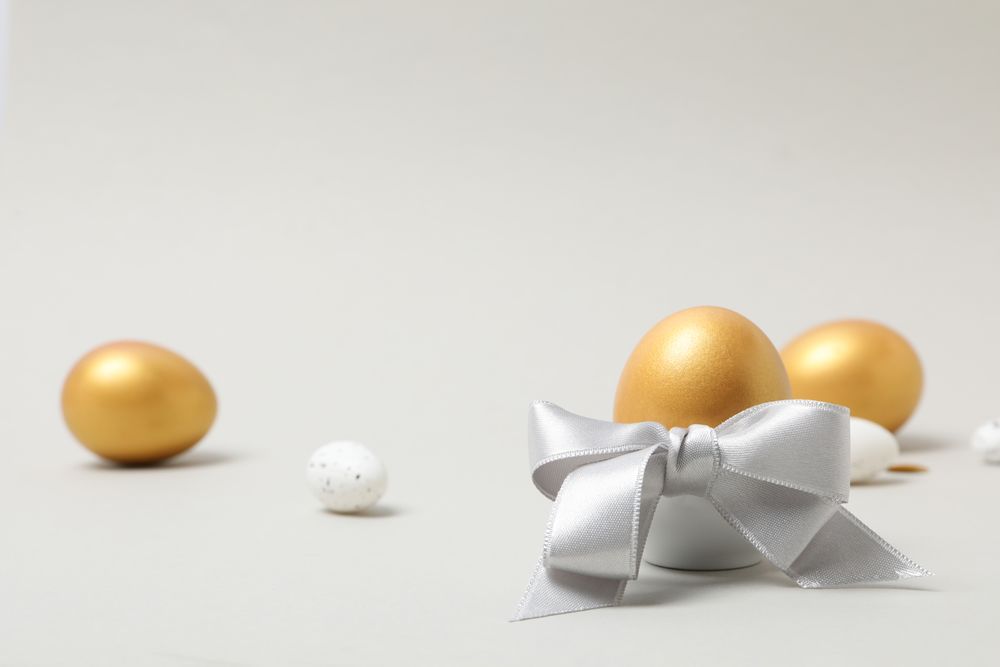 Concept of Richness, golden eggs, space for text