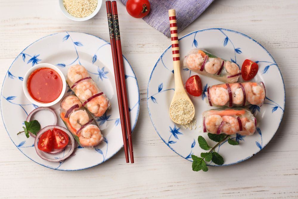 Top view of two plates of Vietnamese food