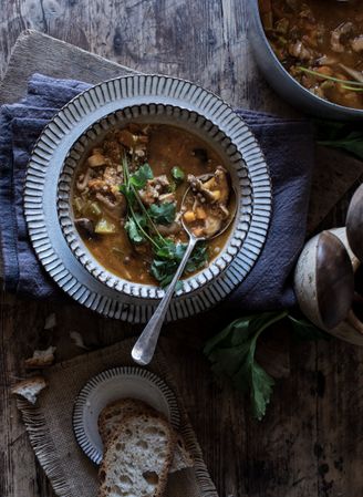Bread and parsley near quinoa soup