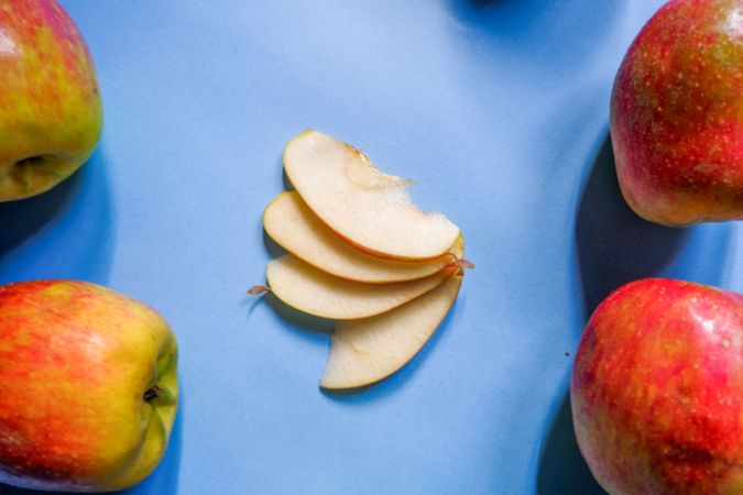 A split apple with a blue background, a perfect photo for a food flogger