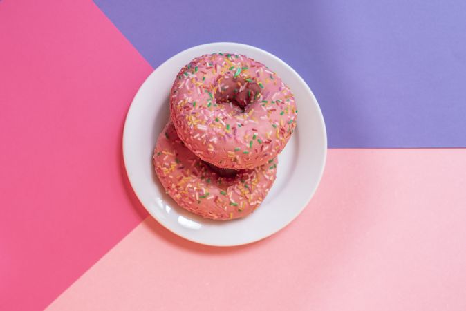 Pink doughnuts in a multicolor background