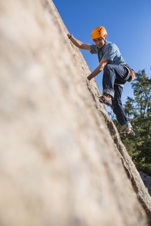 Free climber climbing in nature