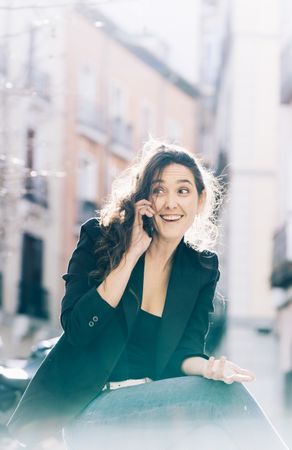Young female walking with smartphone