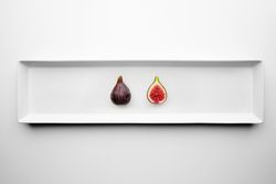 Halved fig on appetizer plate