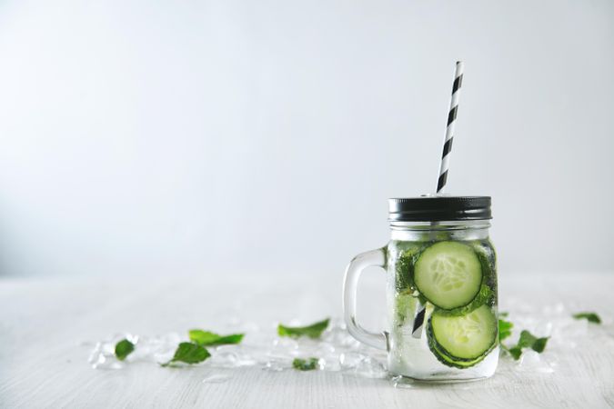 Single glass of mint and cucumber infused water