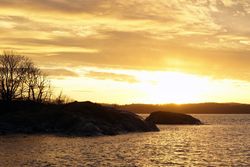 Peaceful seashore lake at sunset