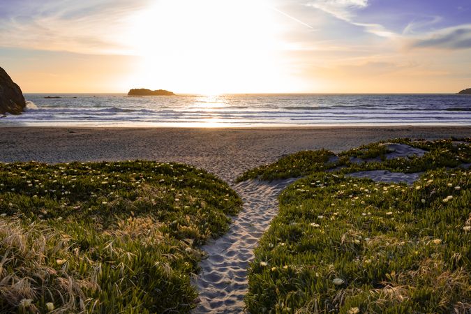 Pedestrian sandy path leading to quiet beach