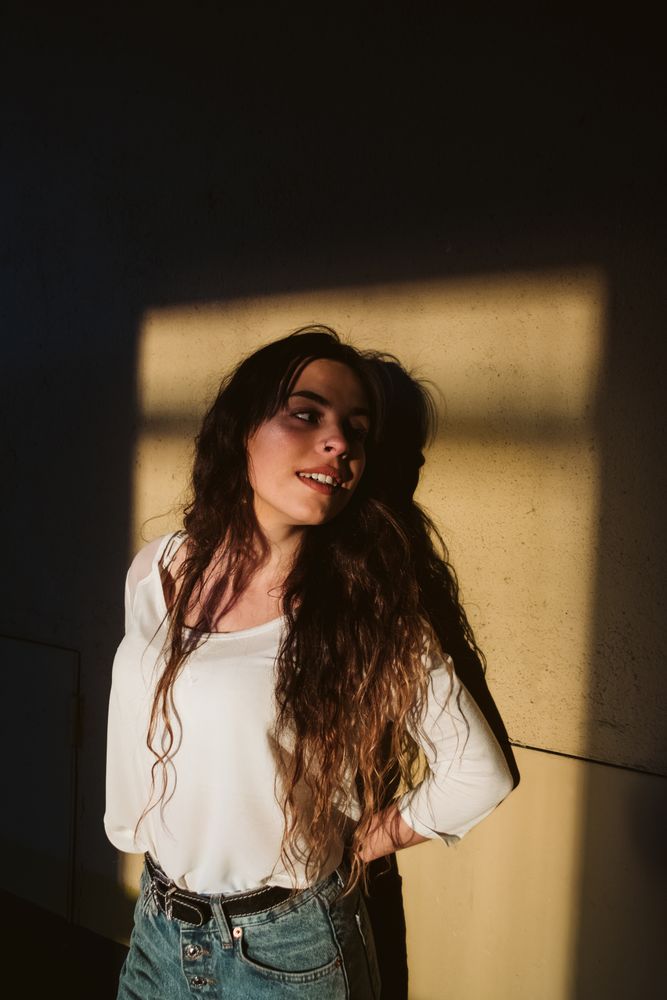 Smiling woman in spot of light