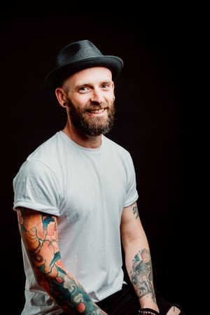 Smiling young guy in hat