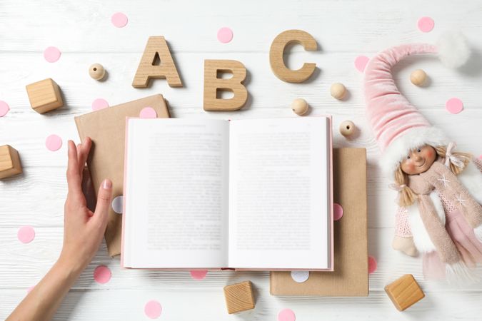 A children's book with toys on a light background.