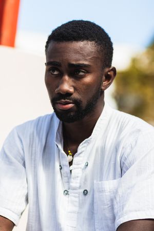 Stylish Black man in city street