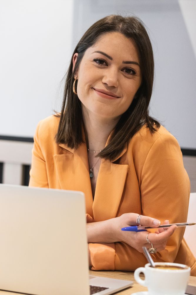 Content woman working on project in cafe