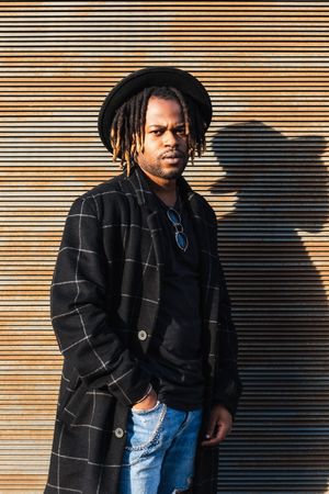 Stylish Black man with dreadlocks on street