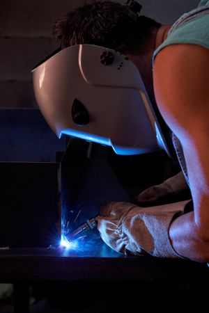 Anonymous worker welding metal structure