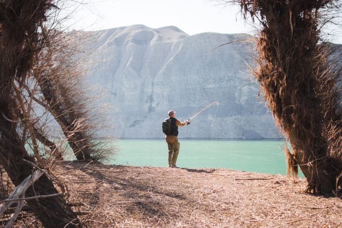 Man fishing near lake