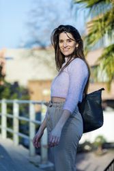 Woman in casual wear on bridge on a sunny day