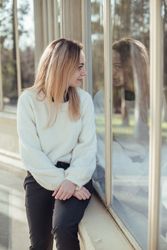 elegant woman sitting in a windows in Crystal Palace