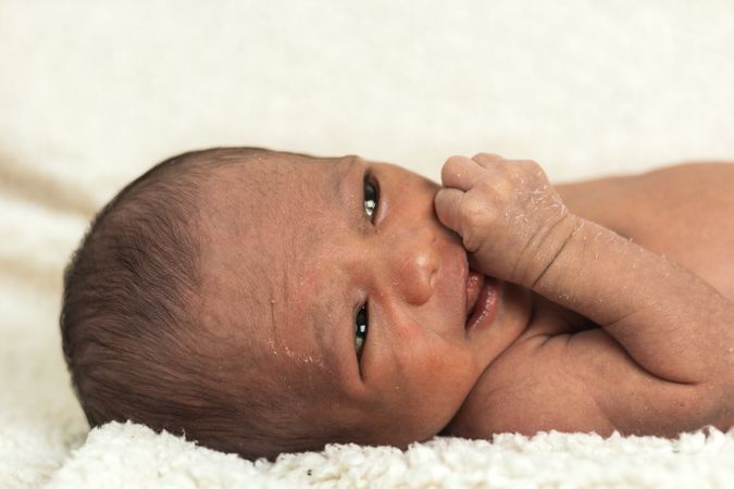 Newborn baby on soft blanket