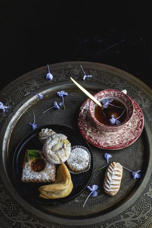 Traditional tea with mint and assorted Arab sweets