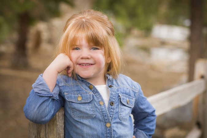 Cute Young Girl Posing for a Portrait Outside