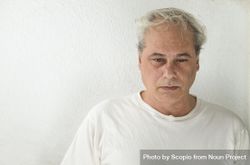 Portrait of unhappy middle aged man in light shirt 4dWjn5