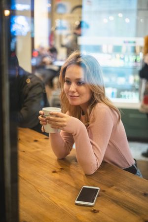 Woman having a cup of coffee