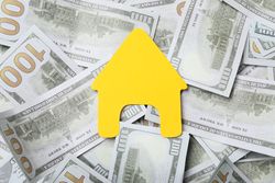 American cash money and yellow house, top view