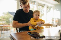Father with his cute baby boy at home 0y2pL5