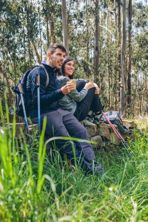 Couple pausing while doing trekking