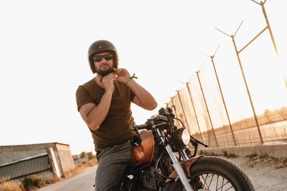 Strong man driving motorcycle