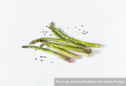 Asparagus with salt and pepper on light background 5RV1JJ