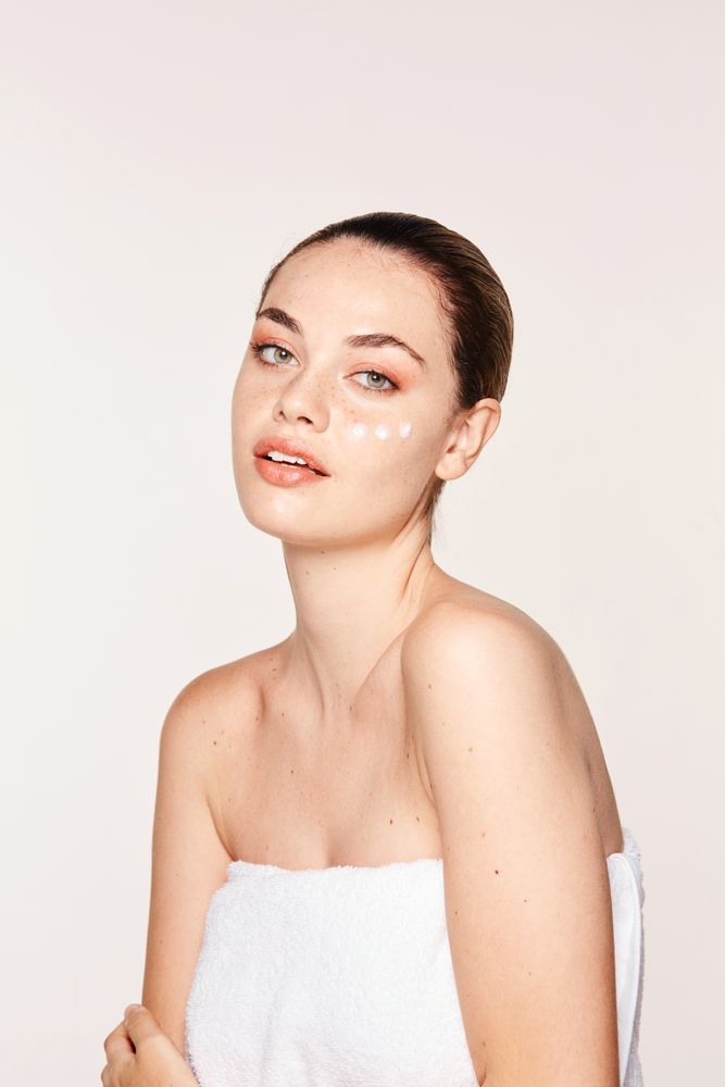 woman with cream on face