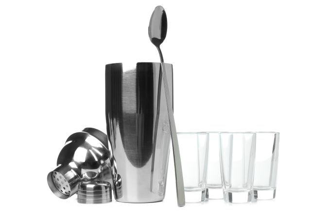 Concept of preparing alcohol drink or cocktail, shaker, isolated on plain background