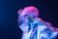 Woman dancing while listening to music
