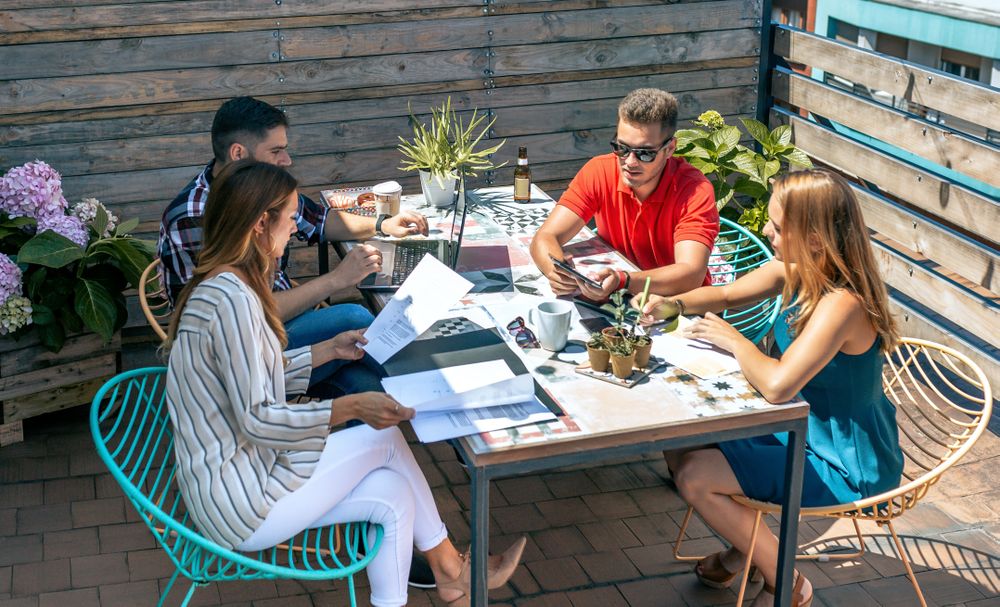 People working on the terrace of the office