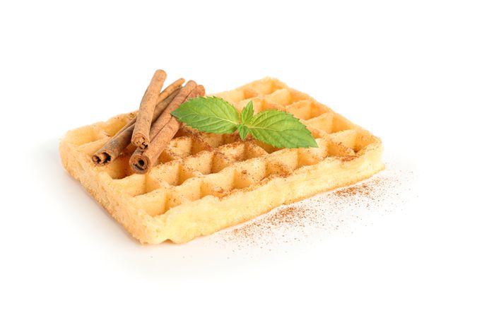 Waffle with mint and cinnamon isolated on blank background