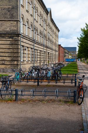 Bikes parked in rack outside building in Copenhagen
