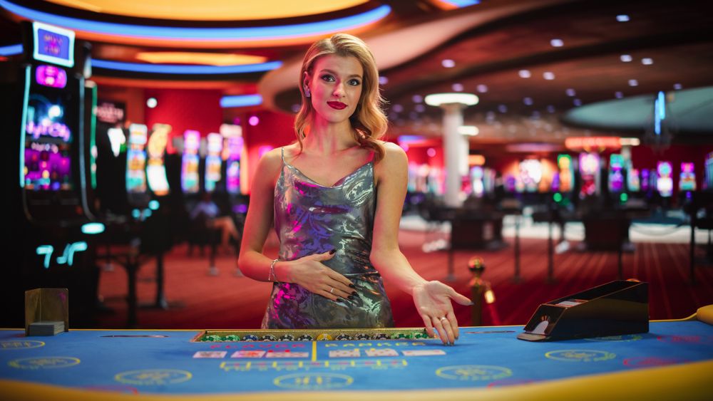 Professional Female Baccarat Croupier In a Fancy Silver Dress