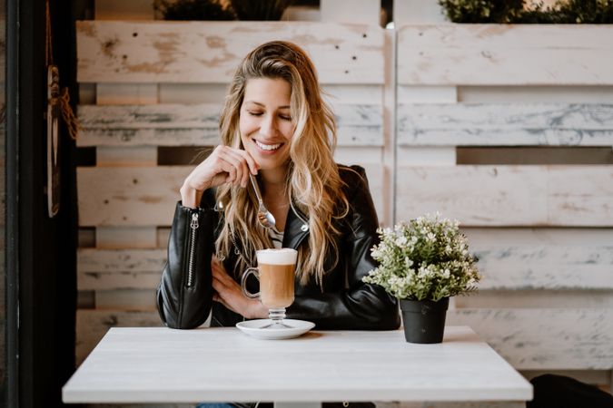 Woman drinking coffee from a glass